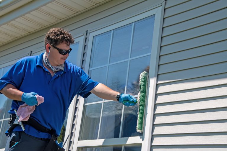 Clean residential windows on a Cushing home